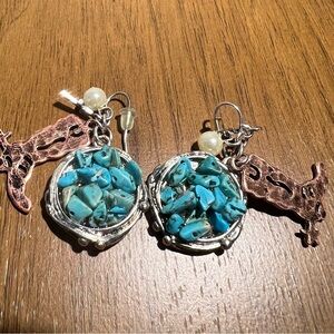 Real crushed turquoise earrings. Metal colour w/ brass, cowboy, boot, and pearl.